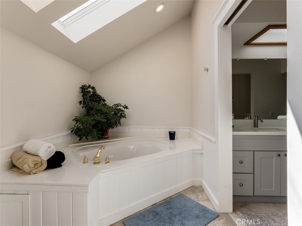 8370 Prado Lane Atascadero, CA 93422 - Photo 33 of 54 a bathroom with a sink and a mirror