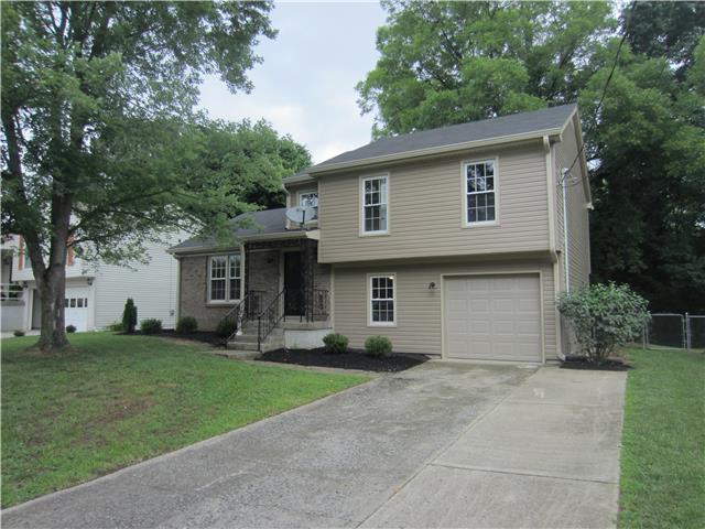 828 Bishopsgate Road Antioch, TN 37013 - Photo 1 of 14 a front view of a house with a garden and trees