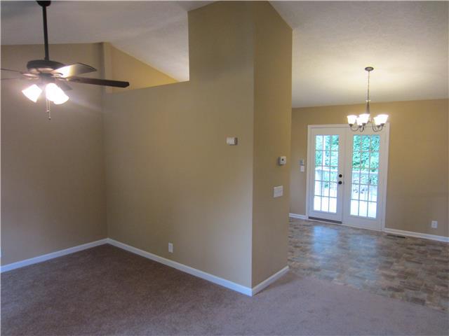 828 Bishopsgate Road Antioch, TN 37013 - Photo 2 of 14 a view of empty room with chandelier fan and refrigerator