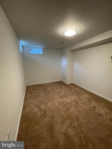 an empty room with a bench