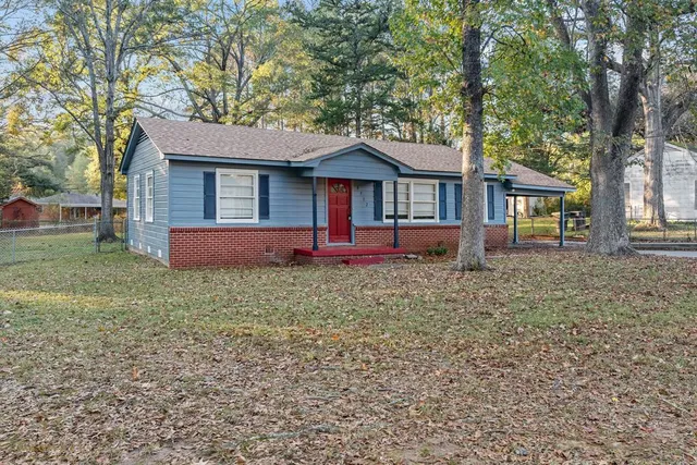 front view of a house with a yard