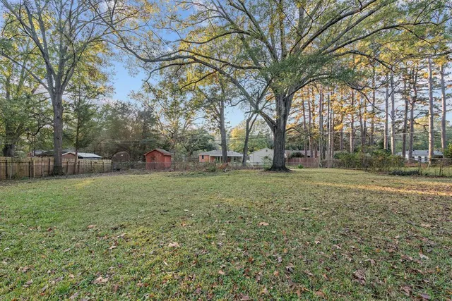 a view of outdoor space with deck and trees