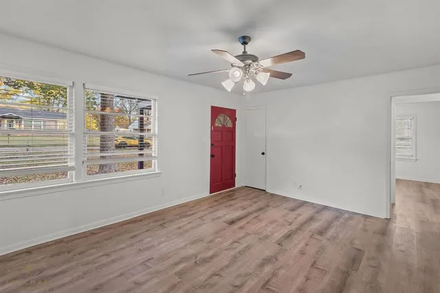 a view of an empty room with a window