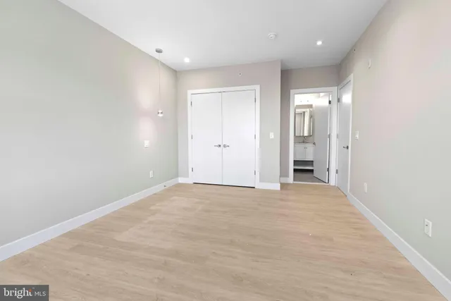a bathroom with a double vanity sink toilet and shower