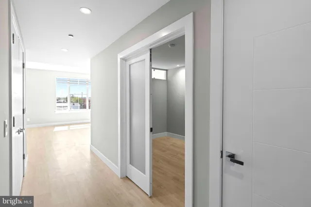 a bathroom with a glass shower door