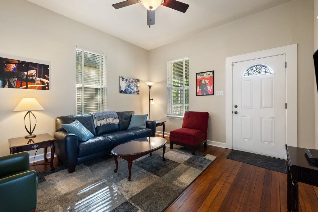 314 West 3rd Street Taylor, TX 76574 - Photo 8 of 27 Living area with beautiful hardwood floors