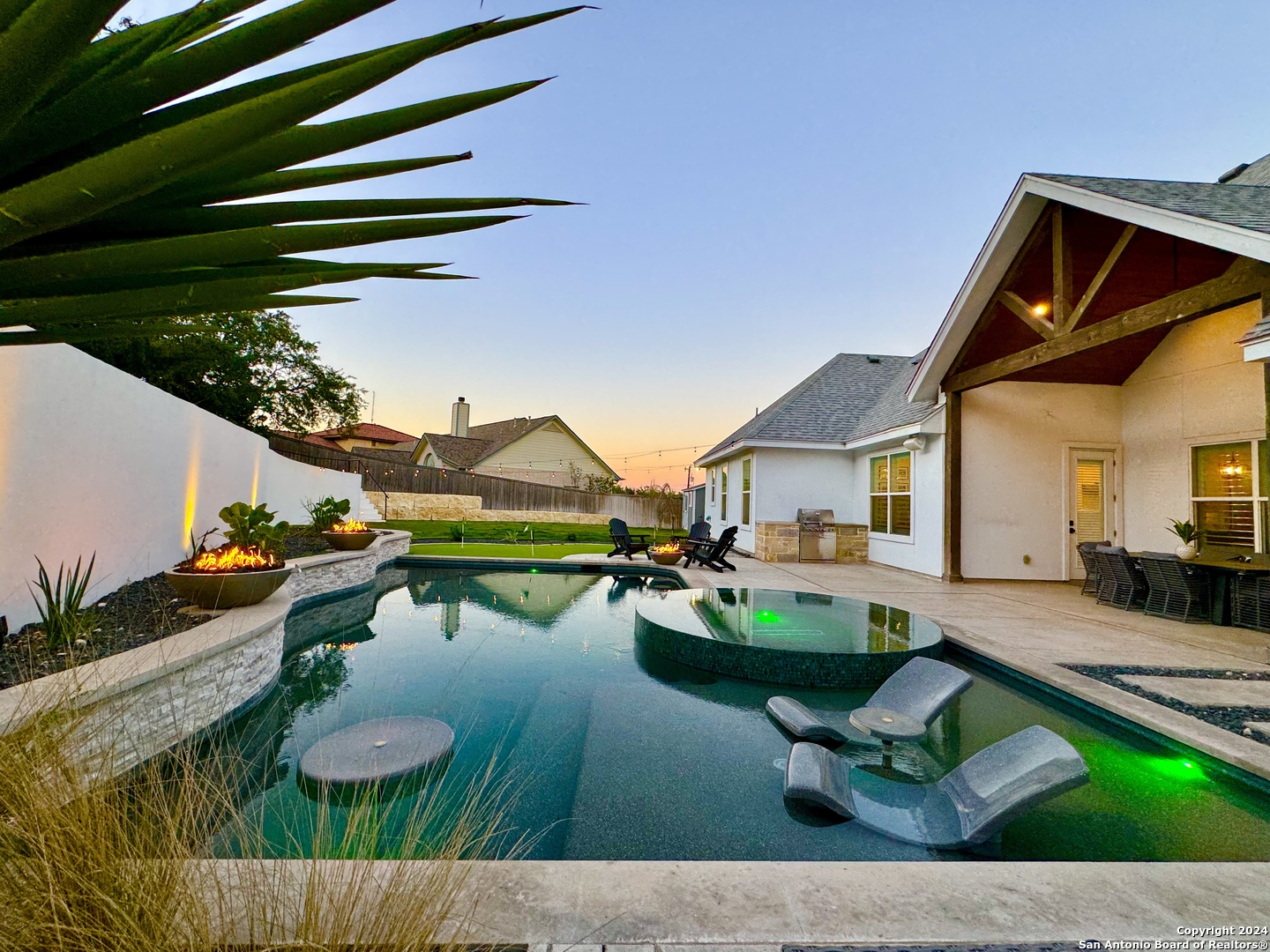 a view of house with backyard outdoor seating area and swimming pool