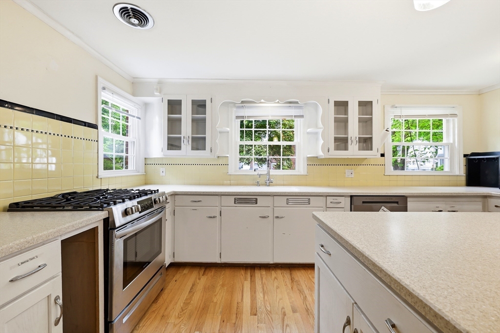 130 Connecticut Avenue Springfield, MA 01107 - Photo 18 of 40 a kitchen with a stove a sink and a granite counter tops