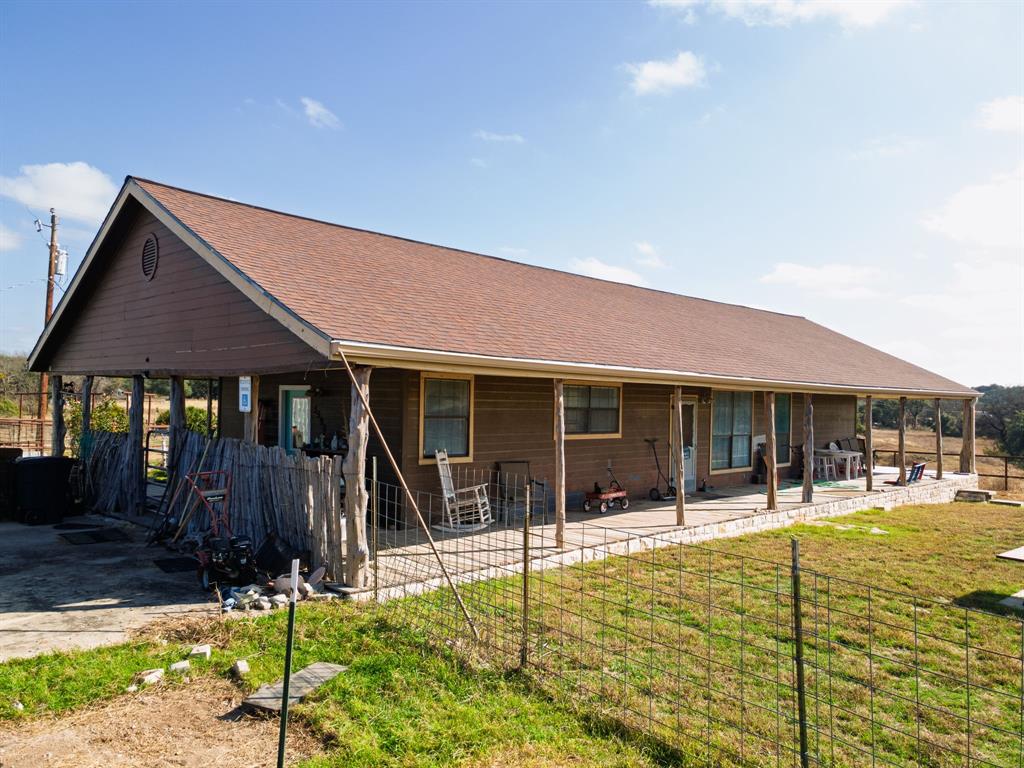 a swimming pool with outdoor seating and yard