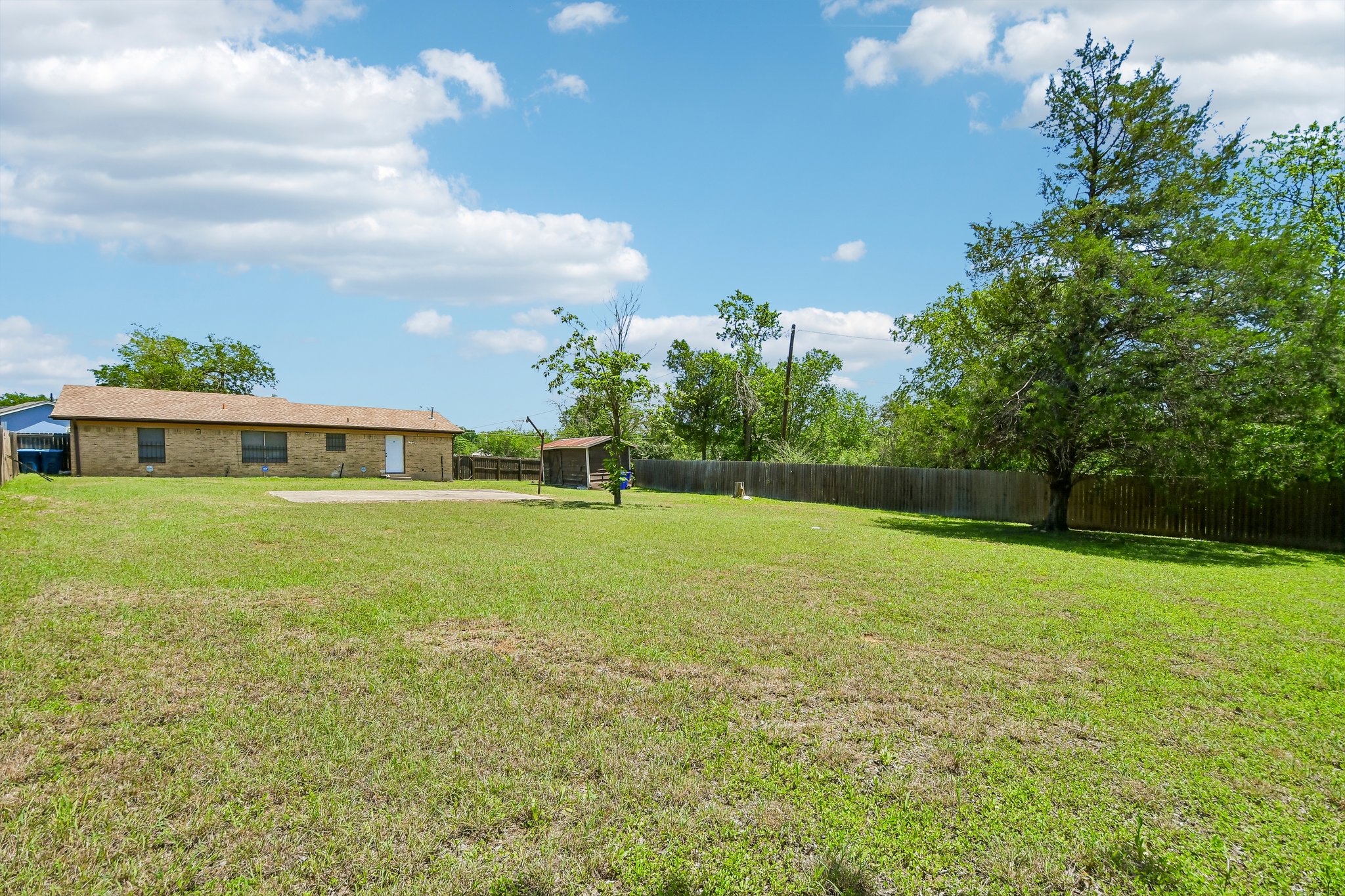 101 Brown Street Elgin, TX 78621 - Photo 32 of 32 a view of green field with house in the background