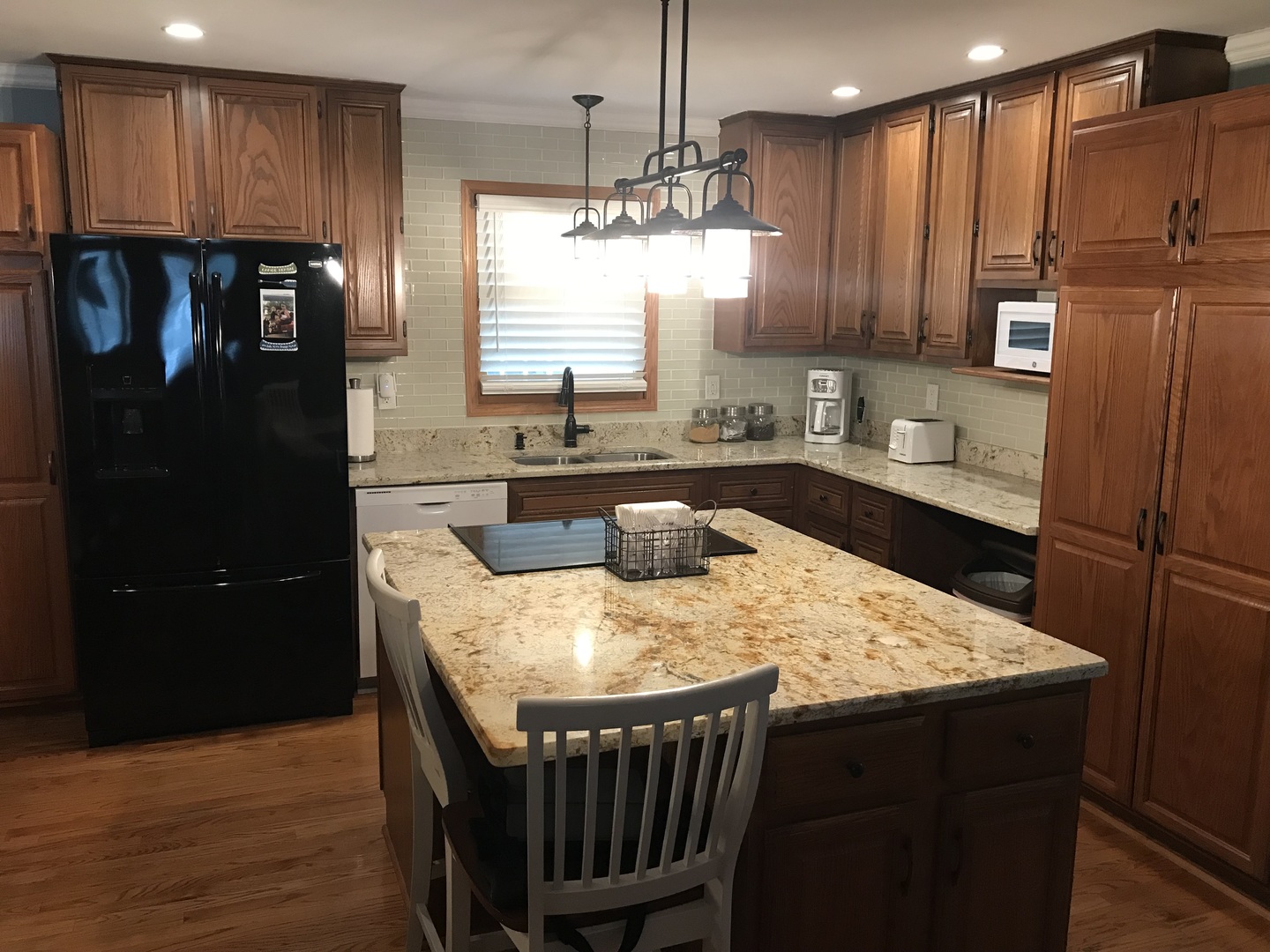 117 Comanche Trail Loda, IL 60948 - Photo 9 of 21 a kitchen with a sink a refrigerator and wooden cabinets
