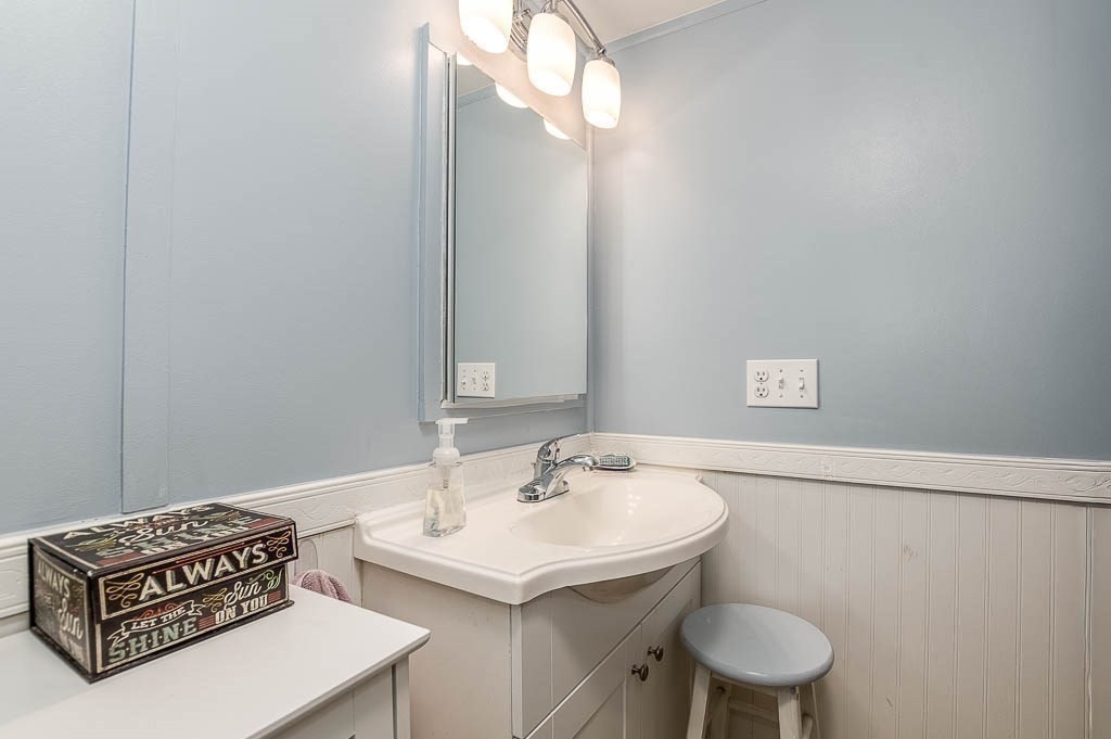 5 Timber Lane Wareham, MA 02571 - Photo 19 of 31 a bathroom with a sink a mirror and a toilet