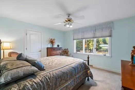 a view of a kitchen area with furniture and kitchen island