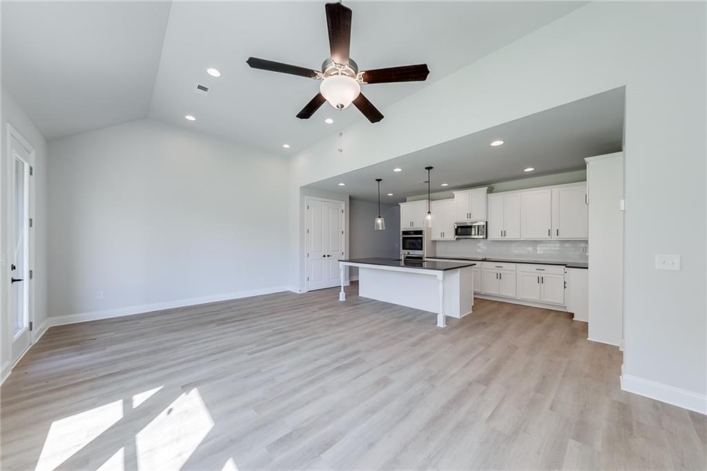 114 Classic Overlook Homer, GA 30547 - Photo 14 of 39 a view of kitchen with wooden floor and window