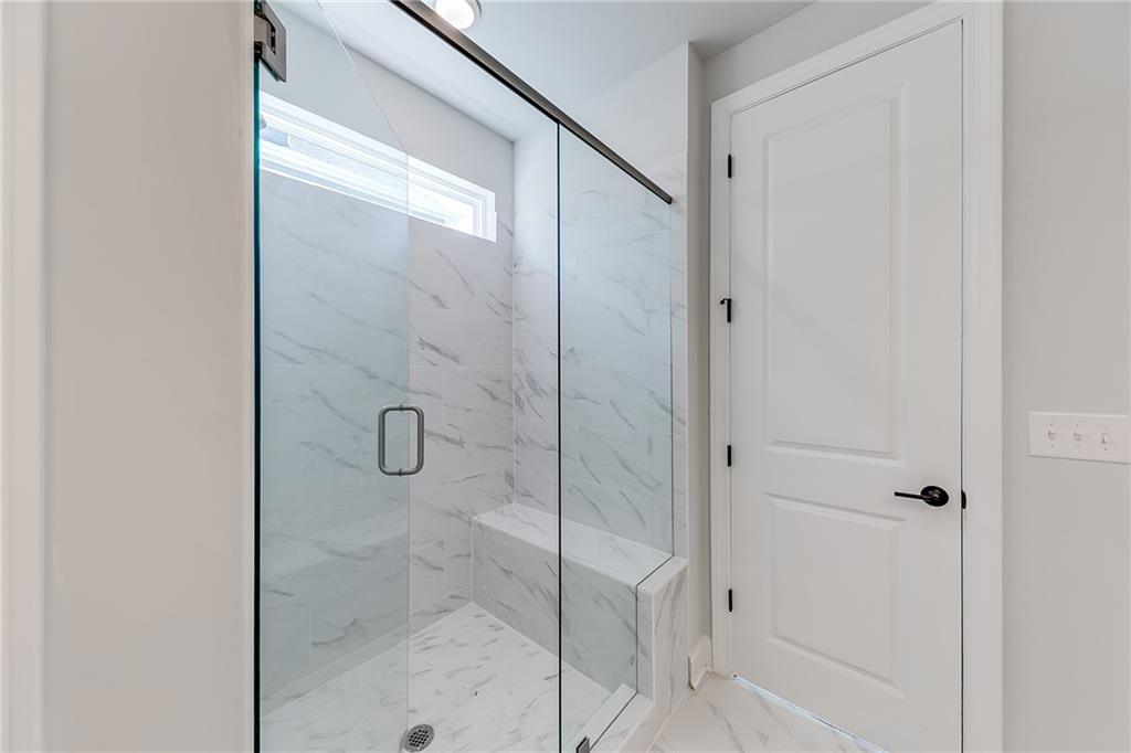 114 Classic Overlook Homer, GA 30547 - Photo 21 of 39 a bathroom with a glass shower door