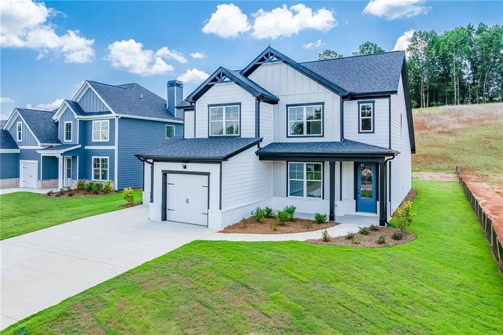 114 Classic Overlook Homer, GA 30547 - Photo 3 of 39 a front view of a house with a yard and garage