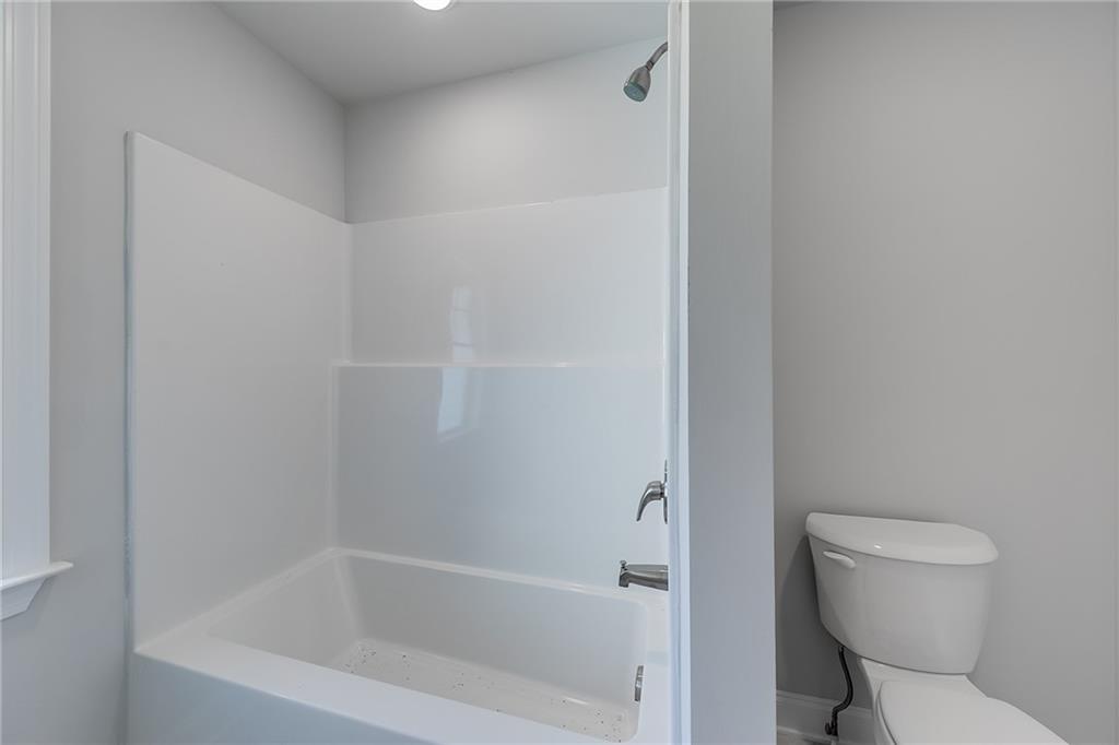 114 Classic Overlook Homer, GA 30547 - Photo 34 of 39 a white toilet sitting next to a bath tub