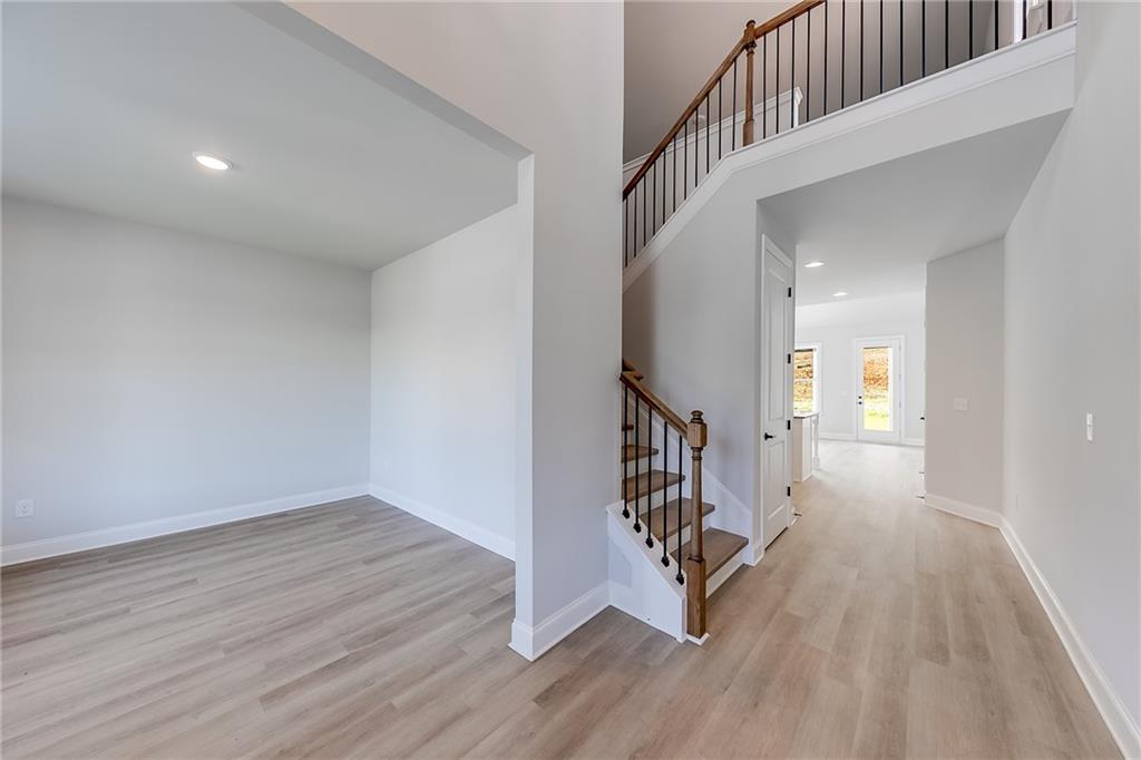 114 Classic Overlook Homer, GA 30547 - Photo 8 of 39 a view of a hallway with wooden floor and stairs