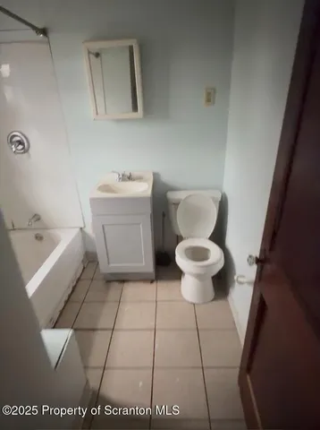 a bathroom with a toilet and a sink