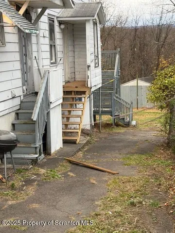 a view of a house with a street