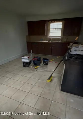 a living room with a wooden floor and a table