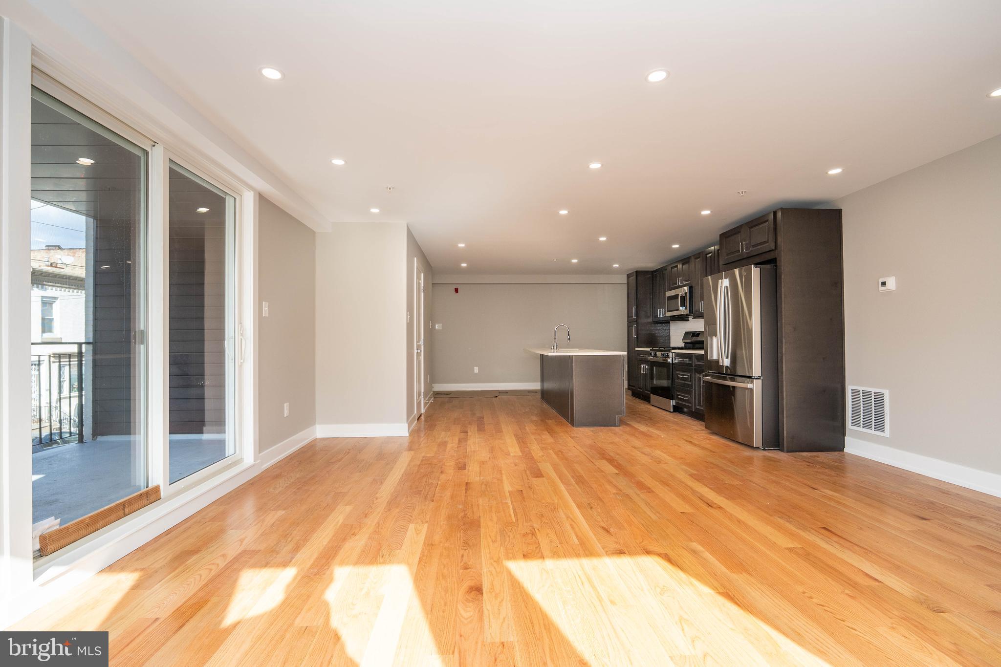 1711 South 5th Street, Unit 3 Philadelphia, PA 19148 - Photo 1 of 9 a view of kitchen with wooden floor