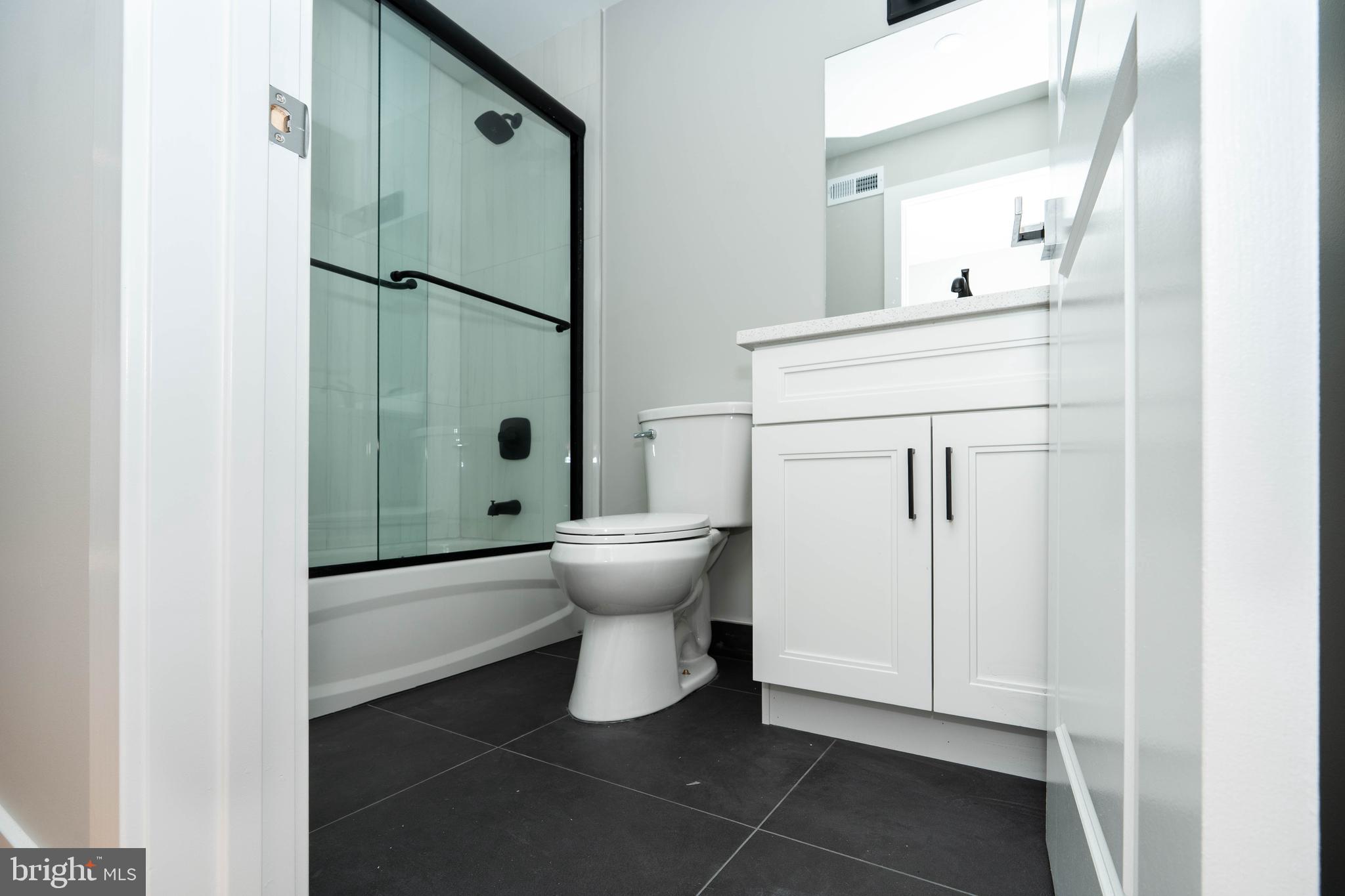 1711 South 5th Street, Unit 3 Philadelphia, PA 19148 - Photo 9 of 9 a bathroom with a toilet and a shower