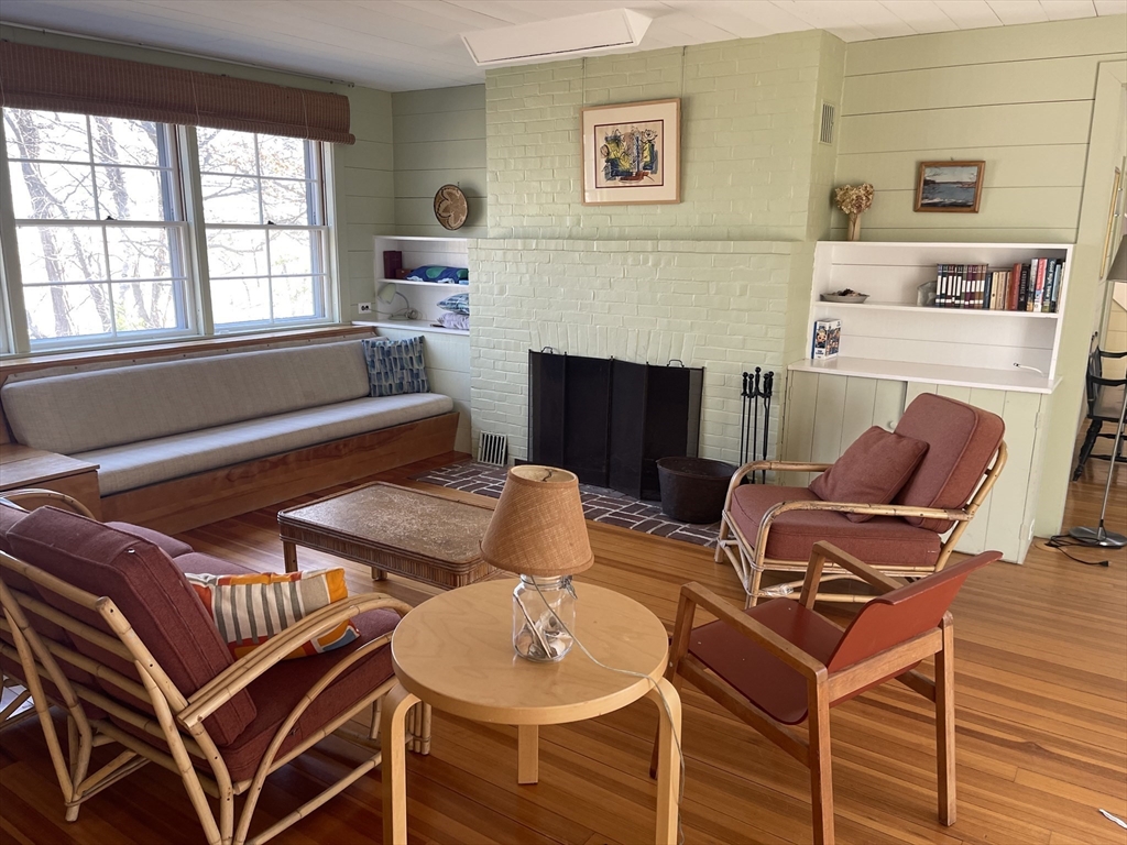 45 Old Cove Road Duxbury, MA 02332 - Photo 3 of 12 a living room with furniture and a fireplace