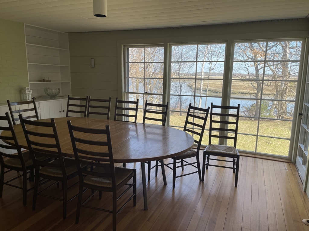 45 Old Cove Road Duxbury, MA 02332 - Photo 4 of 12 a view of a dining room with furniture and wooden floor
