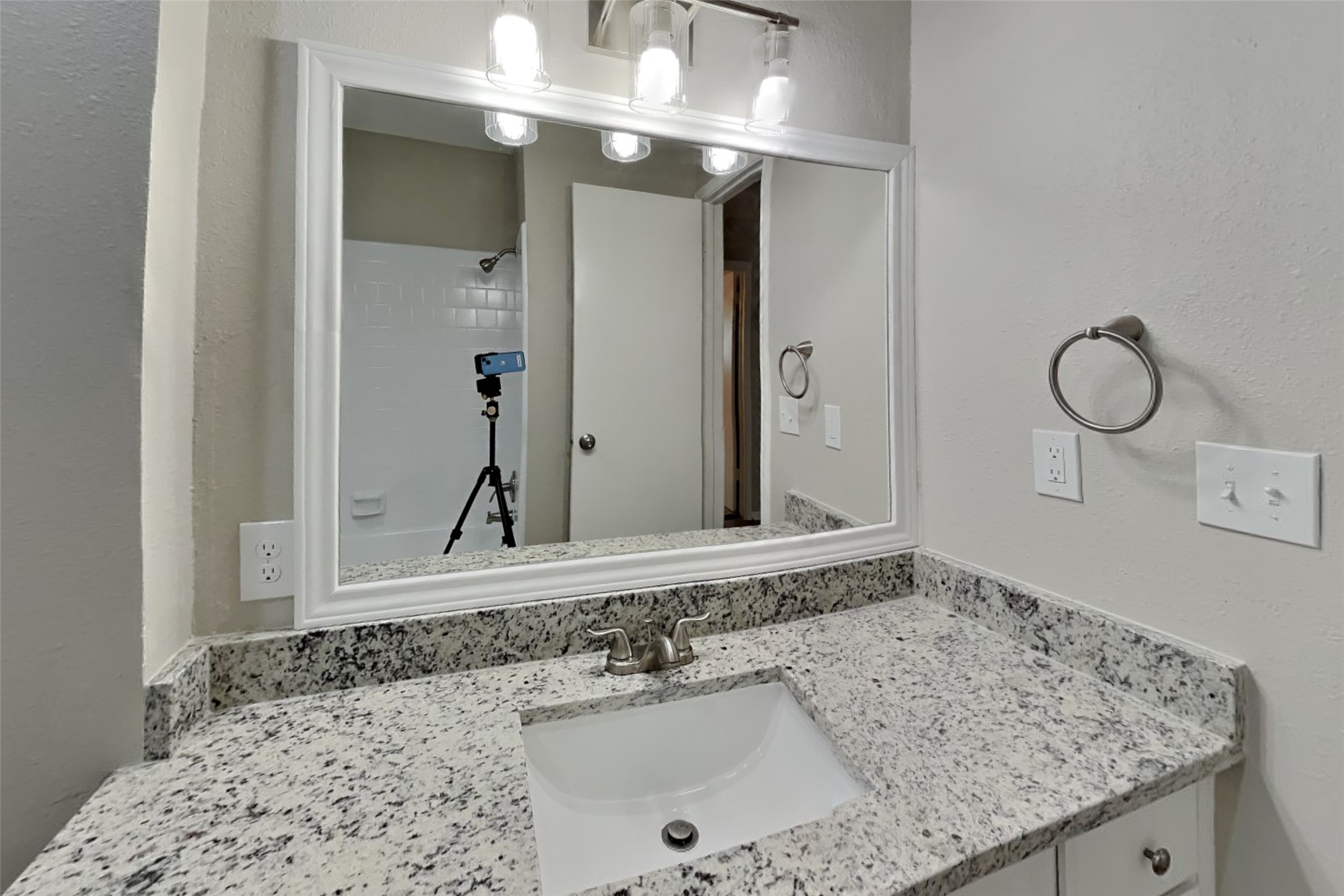 10015 Rippling Fields Drive Houston, TX 77064 - Photo 19 of 24 a bathroom with a sink and a mirror