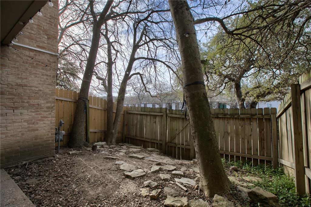 620 South 1st Street, Unit 107 Austin, TX 78704 - Photo 17 of 22 a backyard of a house with lots of green space