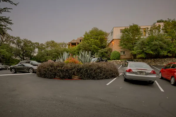 a view of street with parked cars