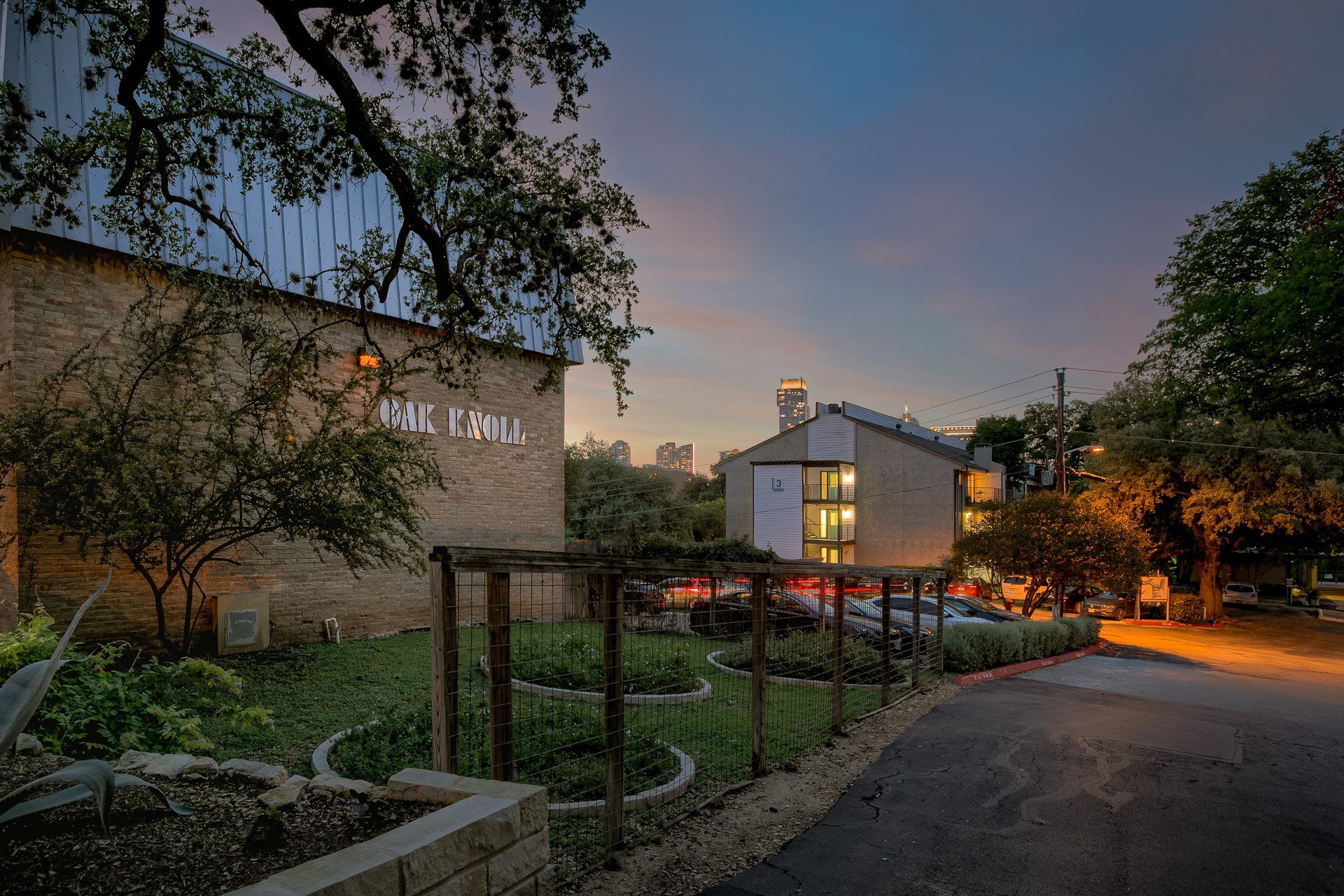 620 South 1st Street, Unit 107 Austin, TX 78704 - Photo 2 of 22 a front view of a house with a yard and a garden