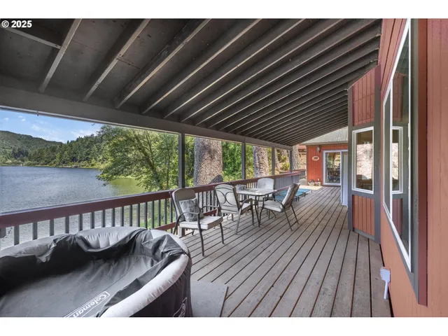 a view of balcony with furniture and wooden floor