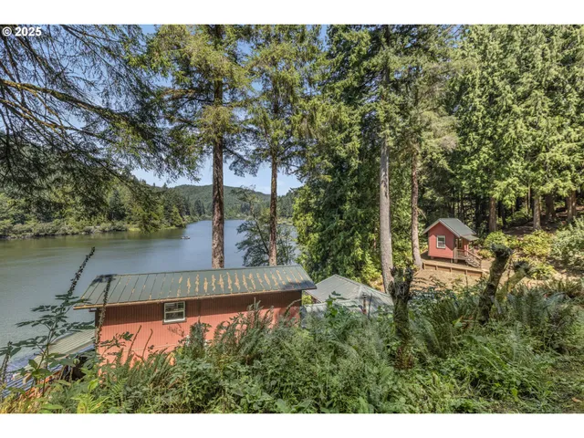a backyard of a house with a yard and outdoor seating