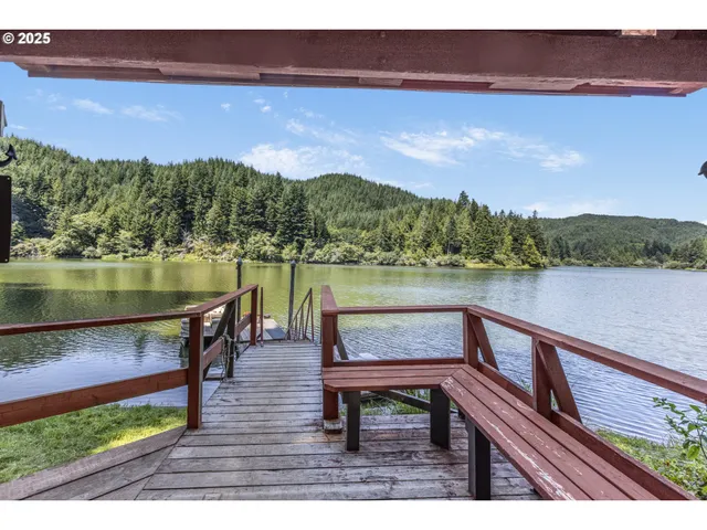 a view of a lake with a bench in a lake