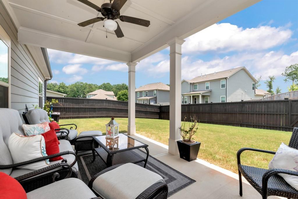 1311 Calgary Lake Drive Winder, GA 30680 - Photo 19 of 45 a building outdoor seating with furniture