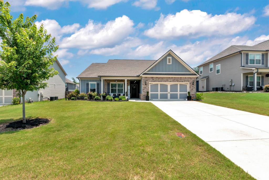 1311 Calgary Lake Drive Winder, GA 30680 - Photo 2 of 45 a front view of house with yard and green space