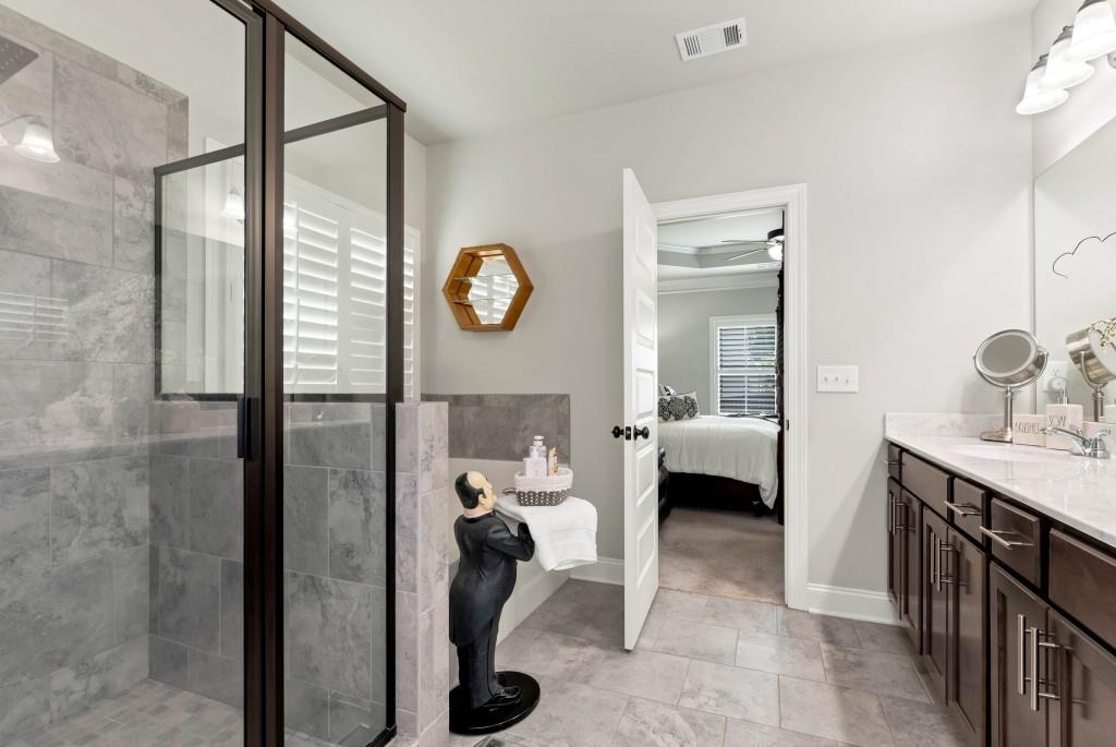 1311 Calgary Lake Drive Winder, GA 30680 - Photo 26 of 45 a en suite bathroom with a toilet a sink and mirror