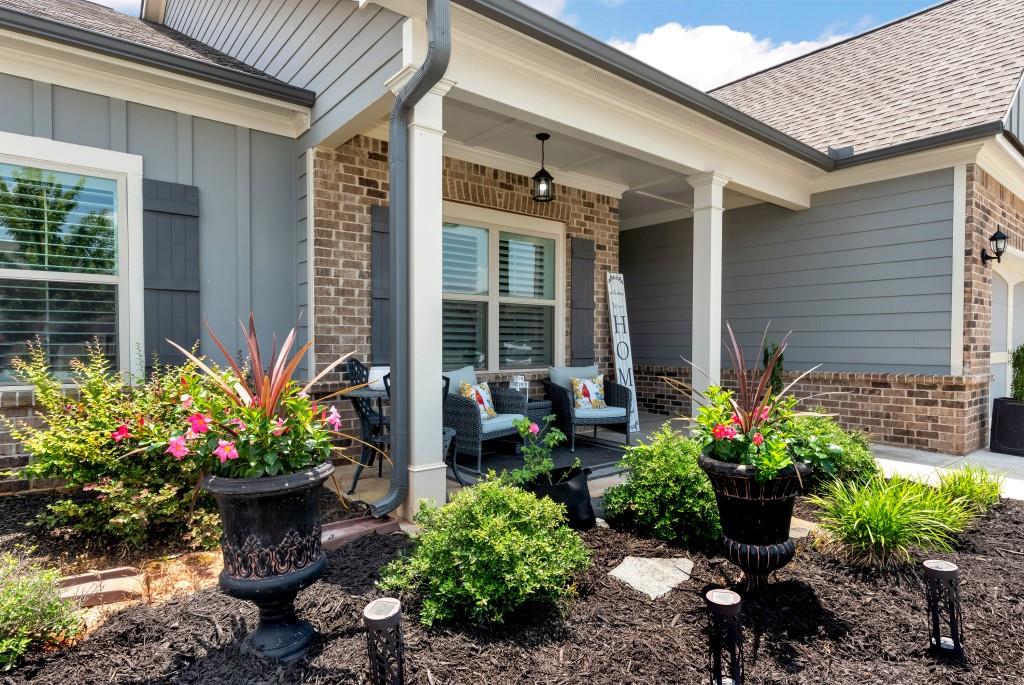 1311 Calgary Lake Drive Winder, GA 30680 - Photo 3 of 45 a view of a potted plant sitting in front of a house