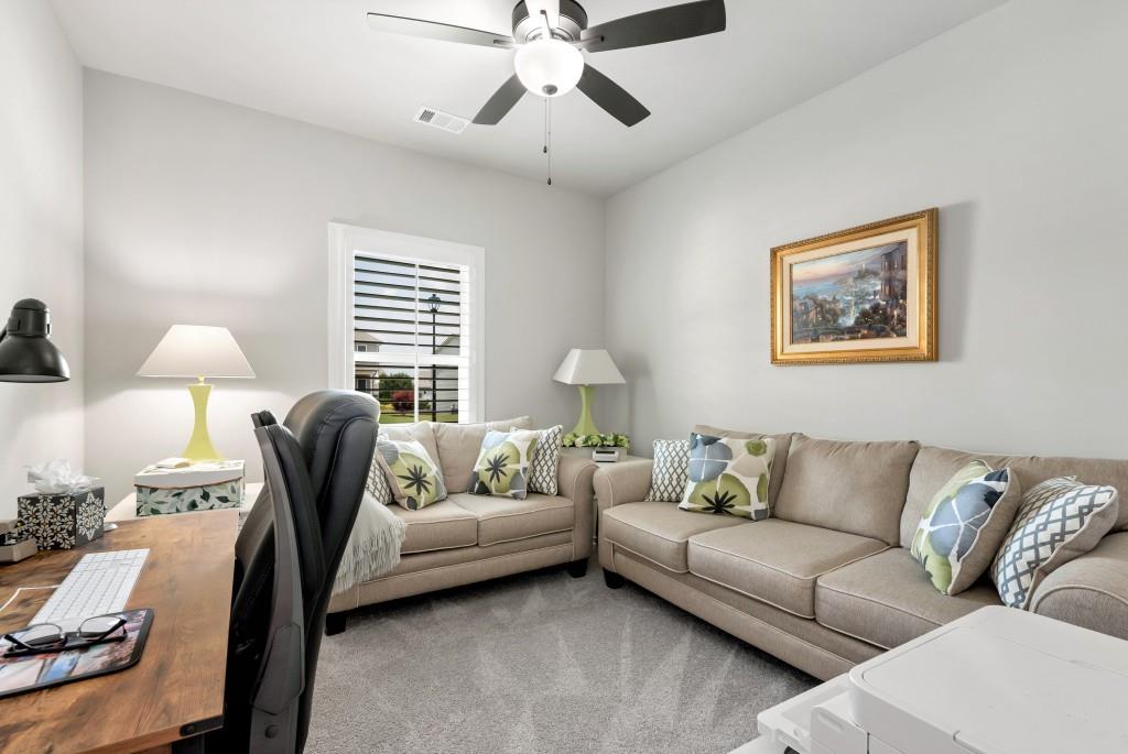 1311 Calgary Lake Drive Winder, GA 30680 - Photo 36 of 45 a living room with furniture and a large window