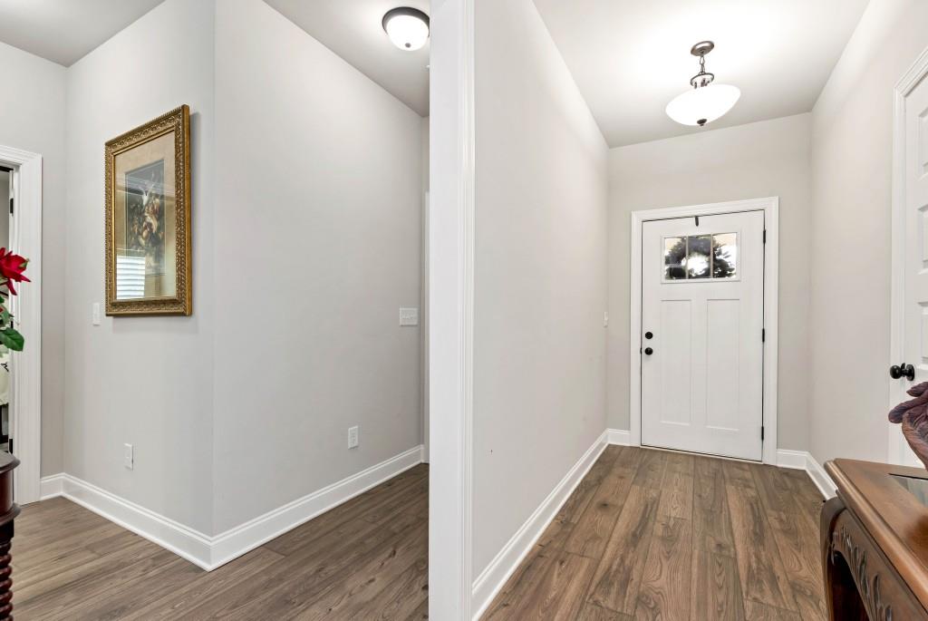1311 Calgary Lake Drive Winder, GA 30680 - Photo 39 of 45 wooden floor in an empty room with a window