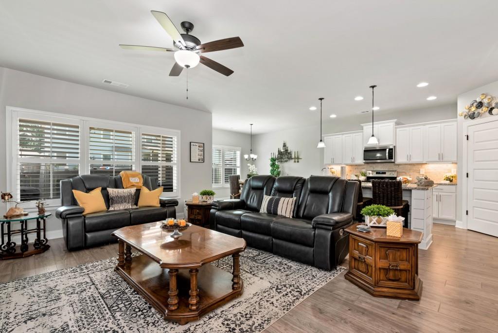 1311 Calgary Lake Drive Winder, GA 30680 - Photo 9 of 45 a living room with furniture kitchen view and a large window