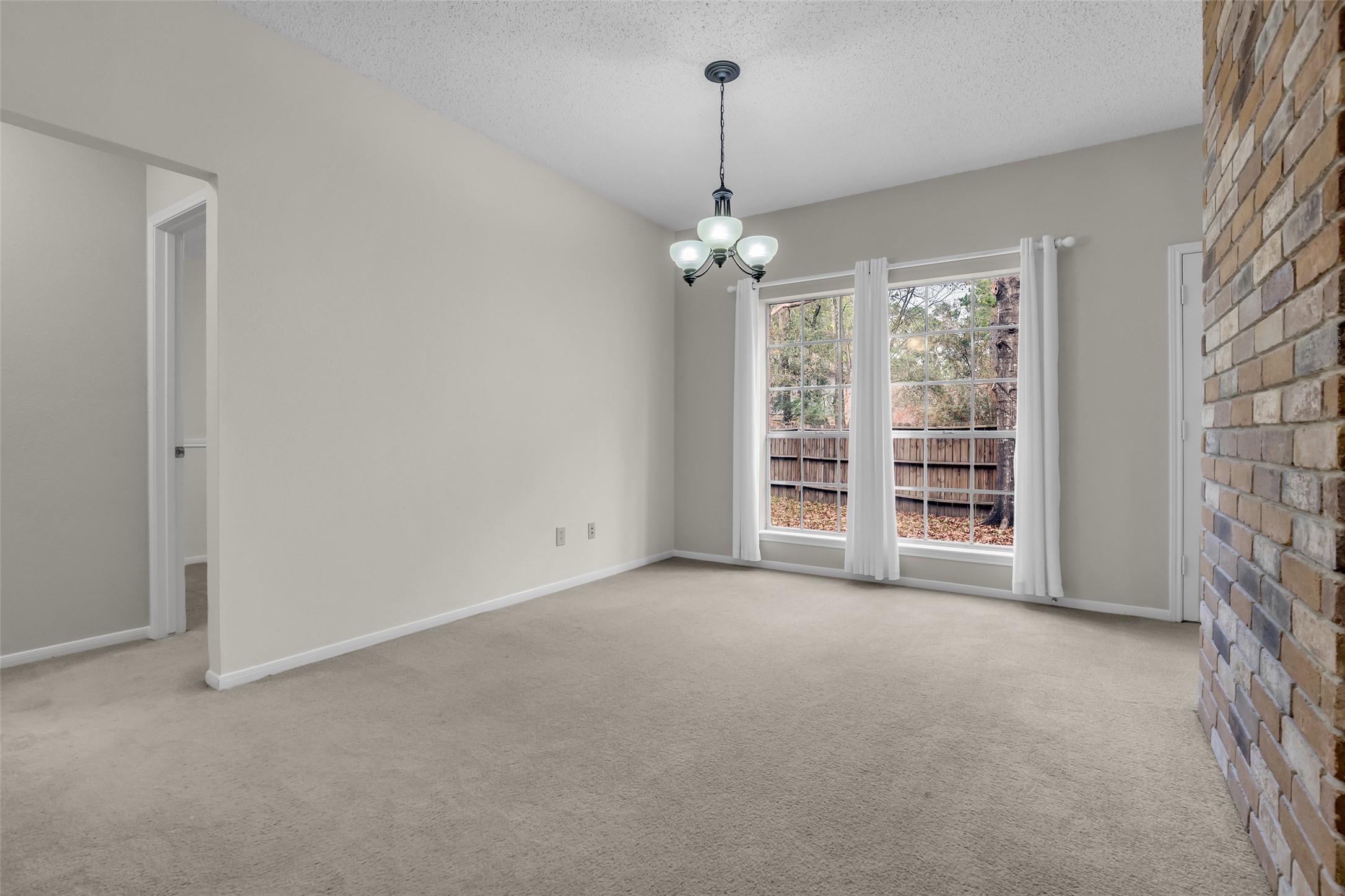 10 Treadwell Court Spring, TX 77381 - Photo 11 of 35 Dining room leading to the bedrooms