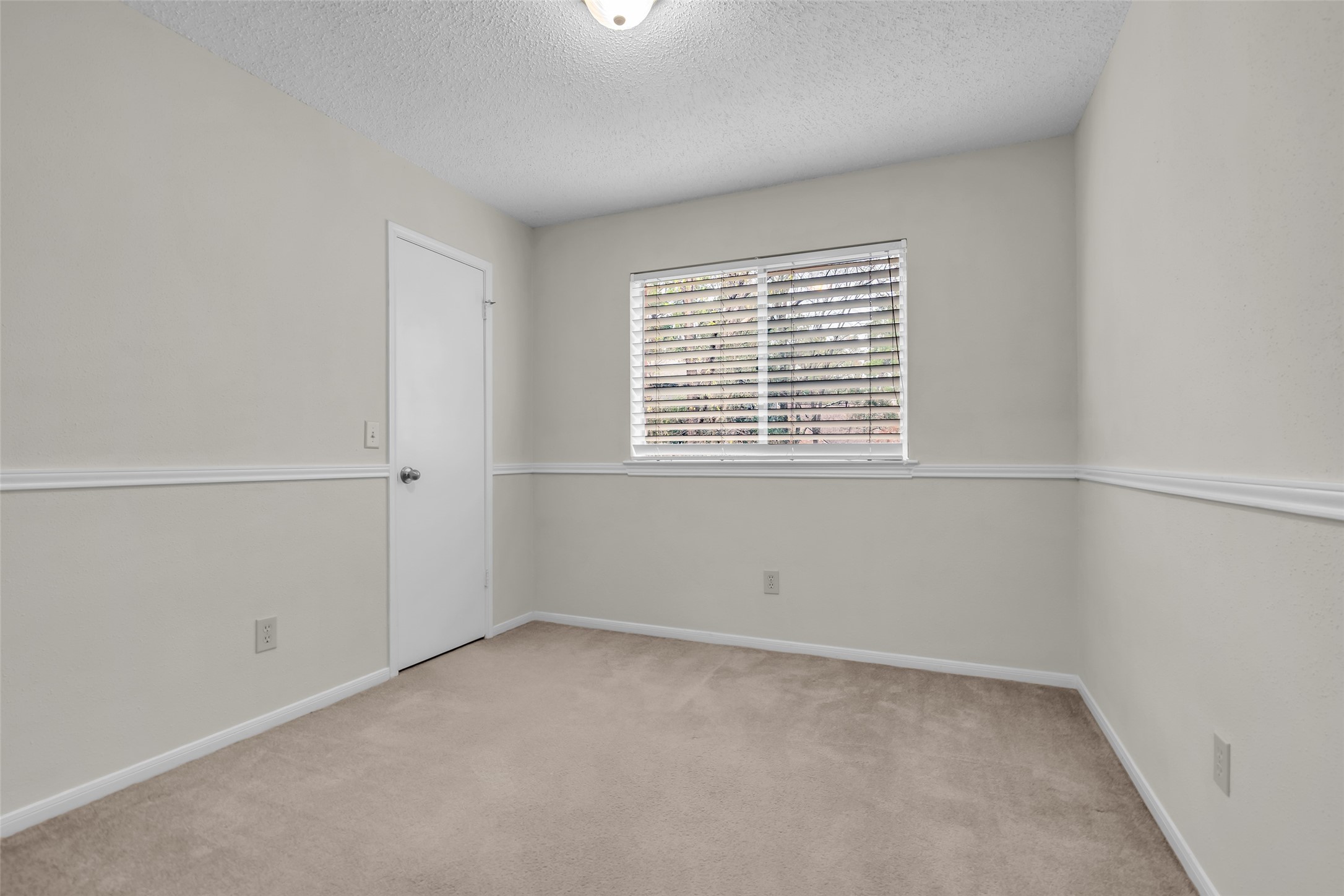 10 Treadwell Court Spring, TX 77381 - Photo 16 of 35 2nd bedroom with a walk-in closet