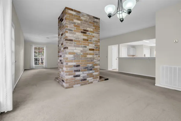 wooden floor in an empty room with a fireplace