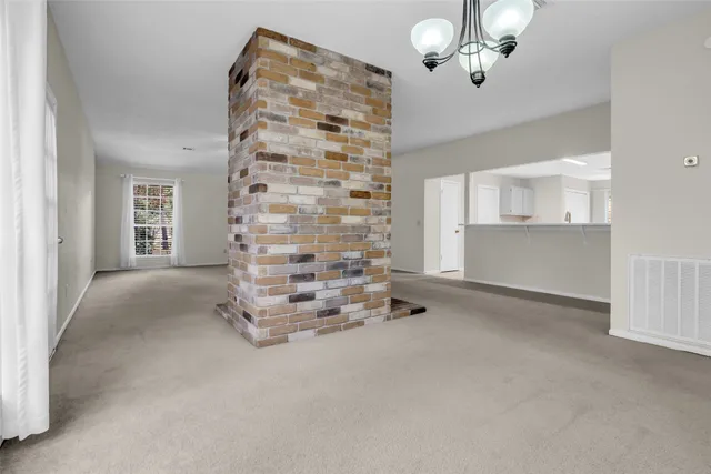 wooden floor in an empty room with a fireplace