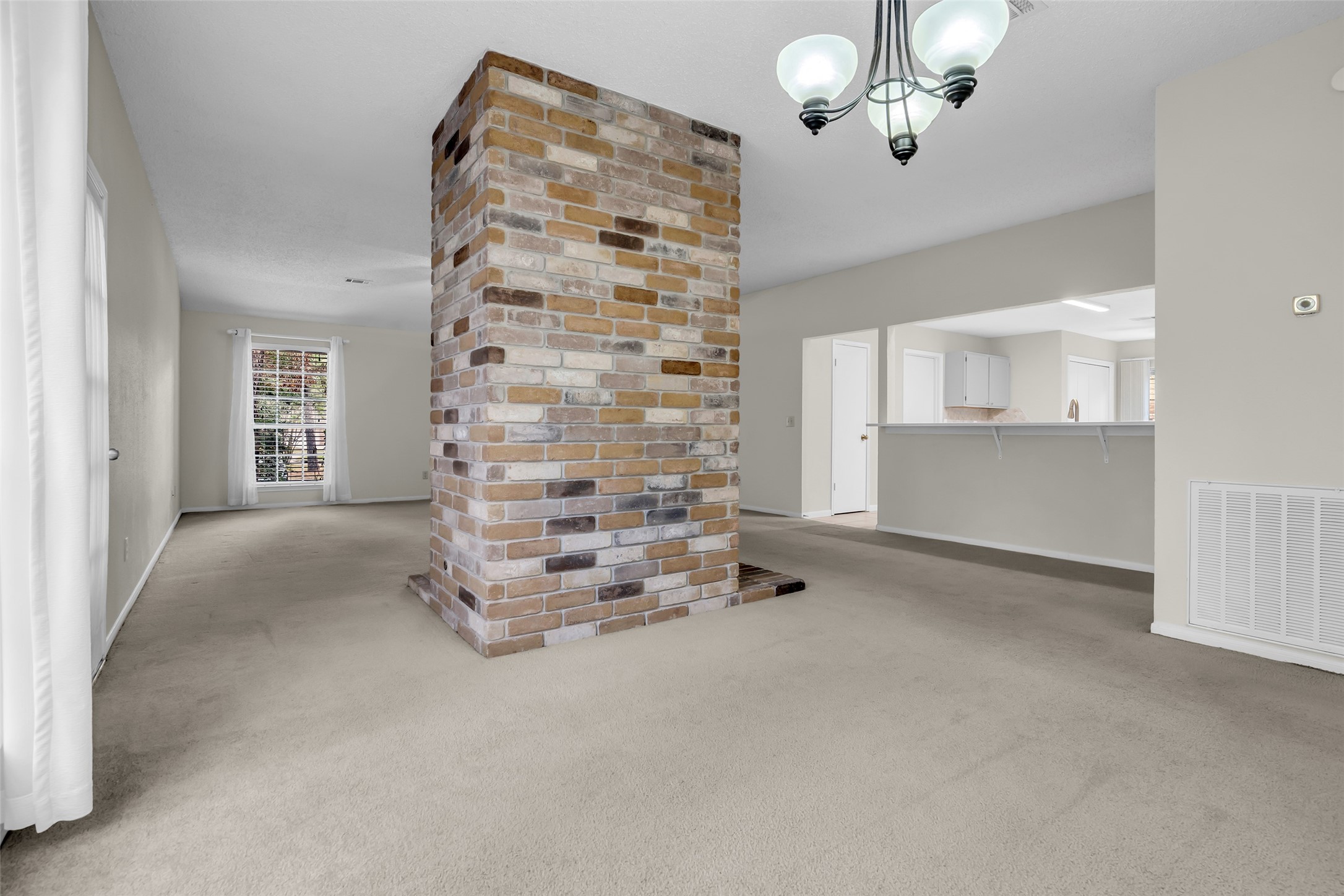 10 Treadwell Court Spring, TX 77381 - Photo 19 of 35 Living room and dining room open to the kitchen for you to enjoy