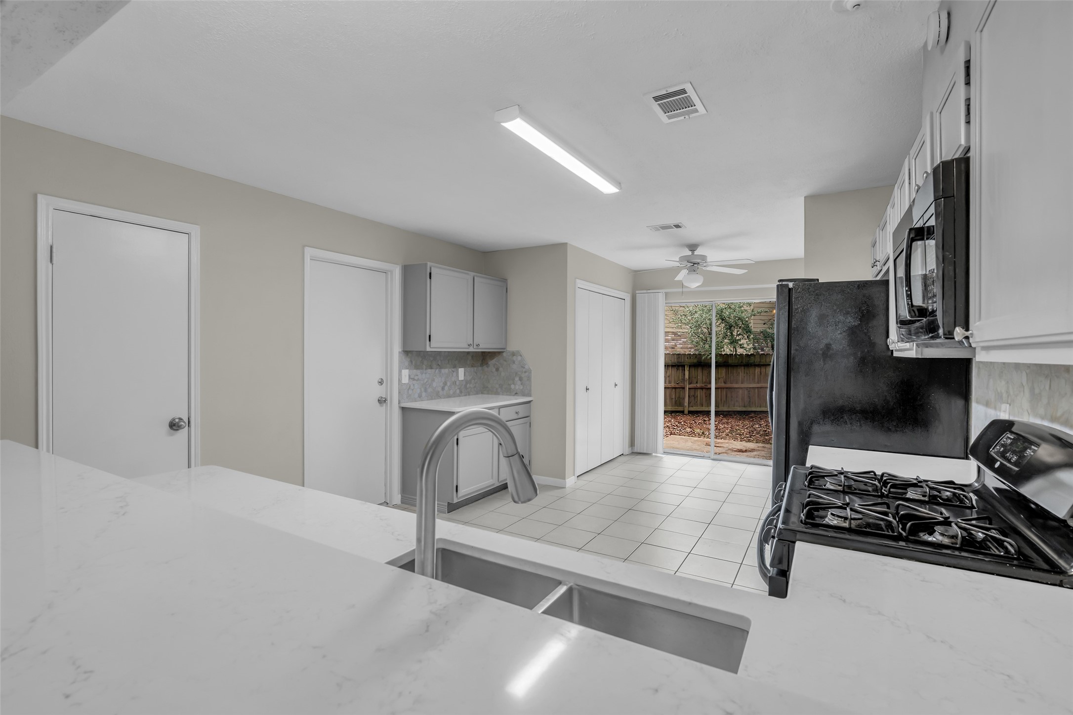 10 Treadwell Court Spring, TX 77381 - Photo 21 of 35 First door is the walk-in pantry, 2nd is to the garage, double doors is where you will put your washer and dryer