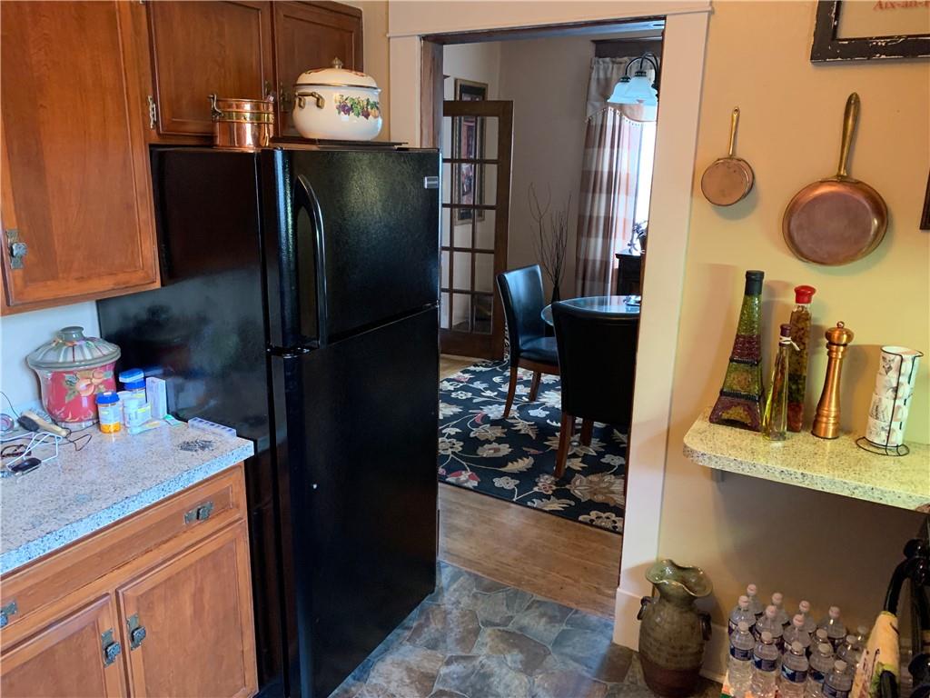 552 4th Street Butler, PA 16001 - Photo 3 of 5 a kitchen with a refrigerator and a stove